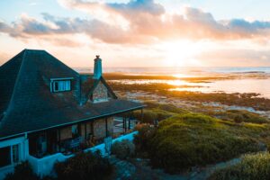 aerial photo of house near calm body of water